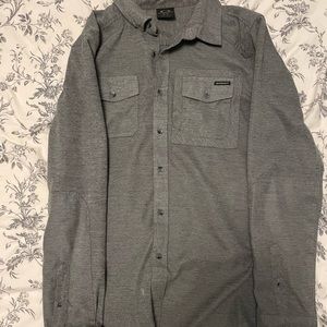 Oakley long sleeve button down. Medium, but fits like a Large. Great condition